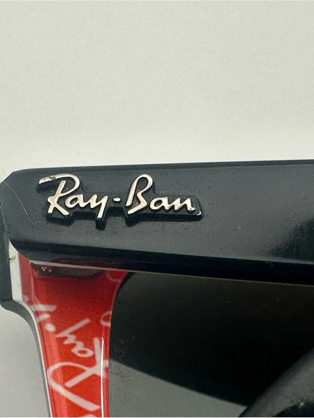 Ray-Ban Black Frame Sunglasses with Red Temples and Green Lenses